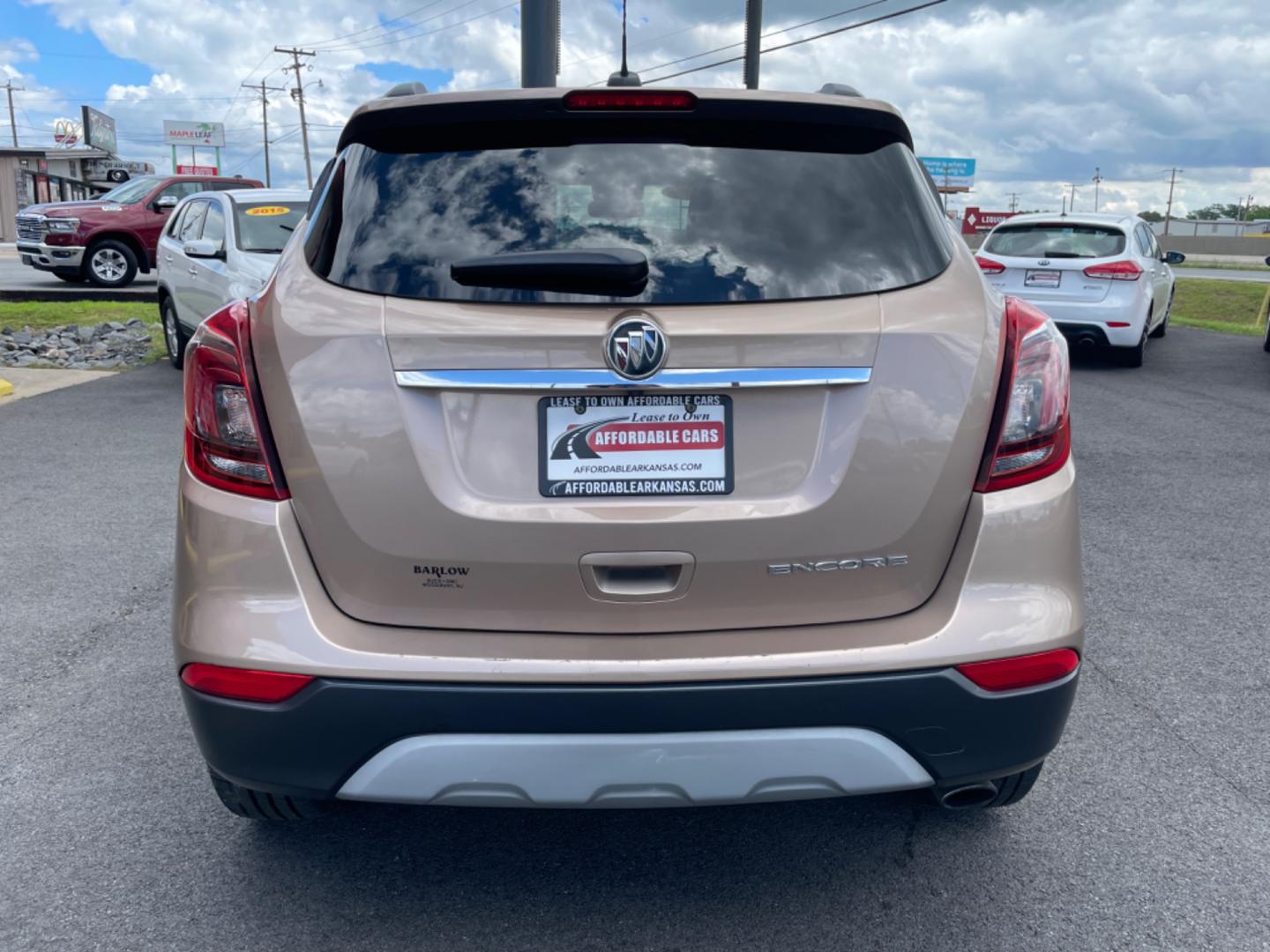 2019 Brown Buick Encore (KL4CJASB6KB) with an 4-Cyl, ECOTEC, Turbo, 1.4 Liter engine, Automatic, 6-Spd w/Overdrive and Shift Control transmission, located at 8008 Warden Rd, Sherwood, AR, 72120, (501) 801-6100, 34.830078, -92.186684 - Photo#6